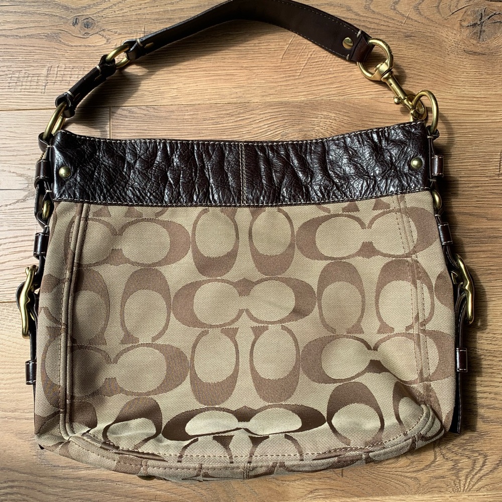 Brown coach purse with purple fabric inside. Gently used. Non smoking home.